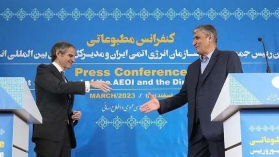 IAEA's Rafael Grossi (left) and Iran's nuclear chief Mohammad Eslami in Tehran on March 4, 2023