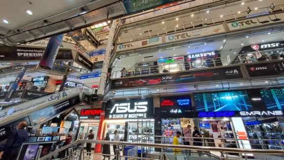 File photo of shoppers visiting a computer and electronics market in Iran, where stores sell laptops, gaming equipment and digital devices.