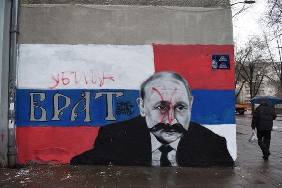 A mural of Russian President Vladimir Putin vandalized and the word "Murderer" written above the original text, "Brother", in Belgrade, Serbia, March 6, 2022