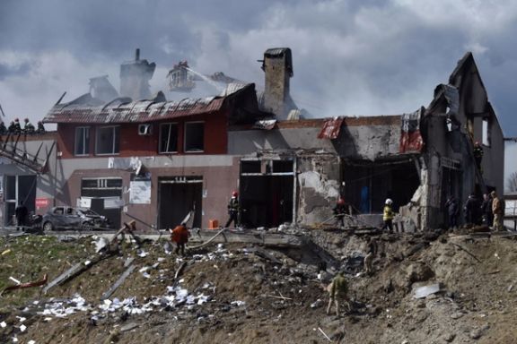 A huge crater next to a damaged building in Lviv after Russian missile strikes on Monday.