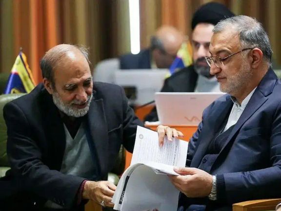 Tehran Mayor Alireza Zakani (R) and his financial deputy Lotfollah Forouzandeh