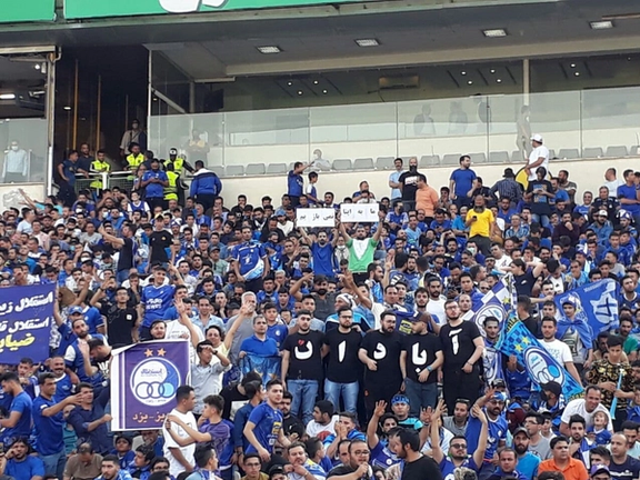 Spectators in Tehran's Azadi soccer stadium unfurling a banner in support of Abadan protests on Monday