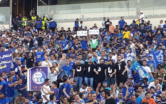 Spectaors in Tehran Azadi stadium unfurl a banner in support of protesters. May 30, 2022