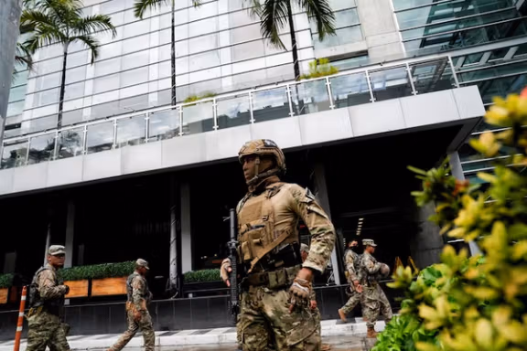 Members of Panama's National Aeronaval Service police (SENAN) stand outside the hotel where migrants from Asia and the Middle East are housed after being deported to Panama as part of an agreement between the administration of US President Donald Trump and the Central American nation, in Panama City, Panama February 18, 2025.