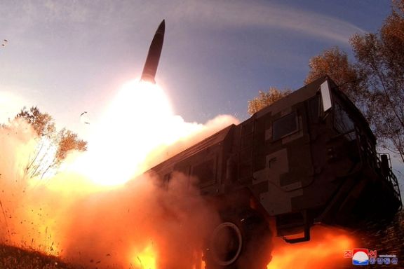 A missile launch is seen at an undisclosed location in North Korea, in this undated photo released on October 10, 2022