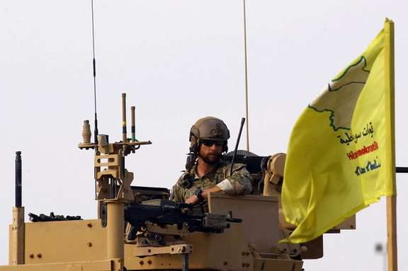 An American soldier sits on a military vehicle, at al-Omar oil field in Deir Al Zor, Syria March 23, 2019.