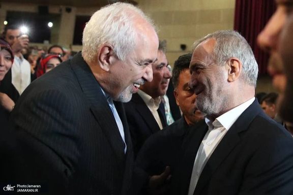 Mohammad-Javad Zarif and Masoud Pezeshkian at campaign meeting in Tehran June 19