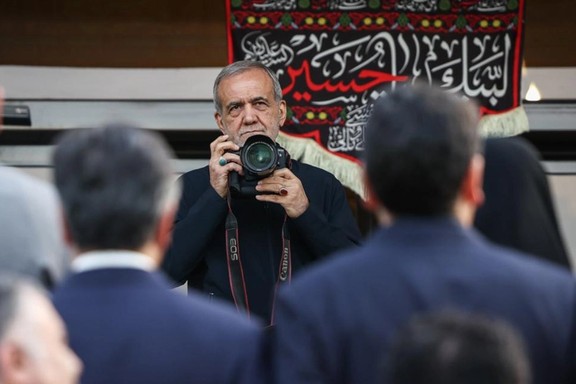 Iran's president Masoud Pezeshkian taking pictures at a meeting of his Cabinet with reporters, Tehran, Iran, August 10, 2025