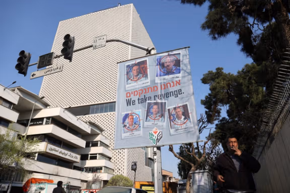 An anti-Israel banner with pictures of senior Israeli commanders in a street in Tehran, Iran, April 2, 2024
