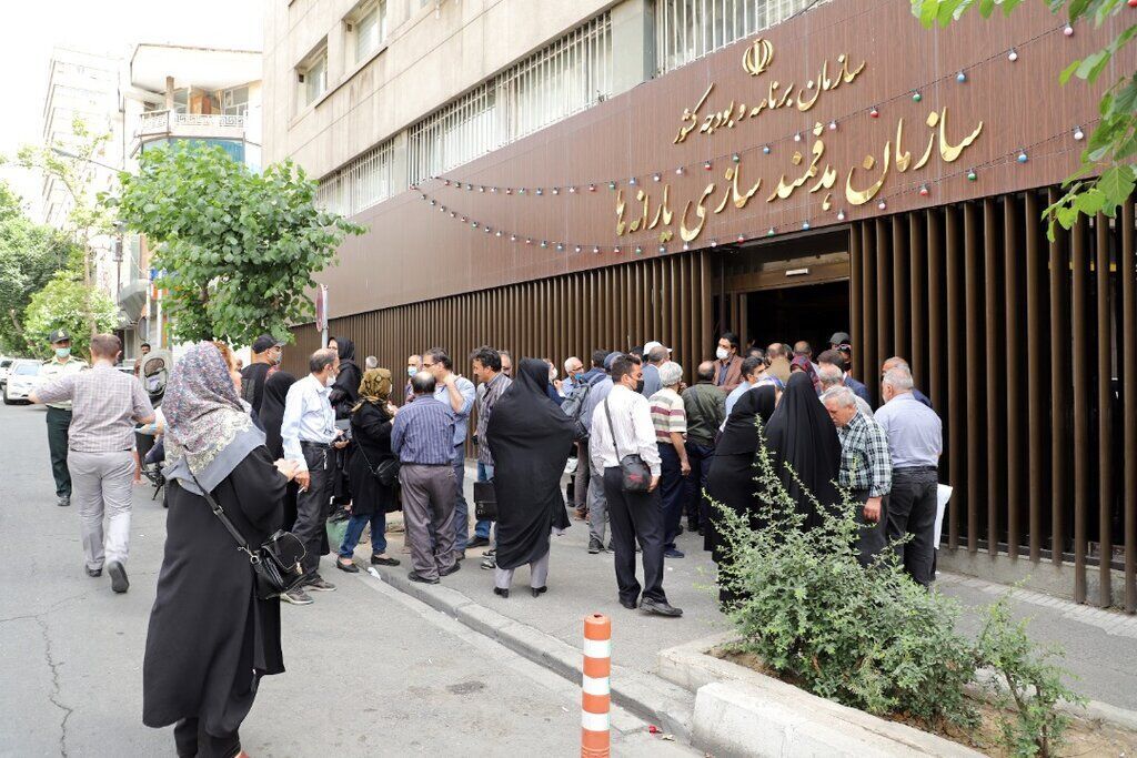 A group of people holding a demonstration outside the government's Targeted Subsidies Organization in Tehran (file photo) 