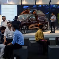 As the rial sinks, Iranians seek shelter in almost anything else