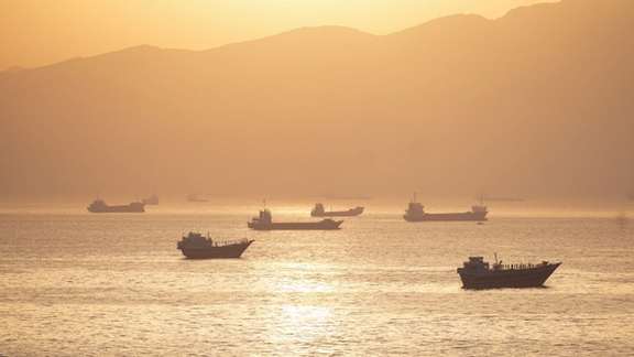 A view of ships near the Strait of Hormuz at sunset, file photo, undated