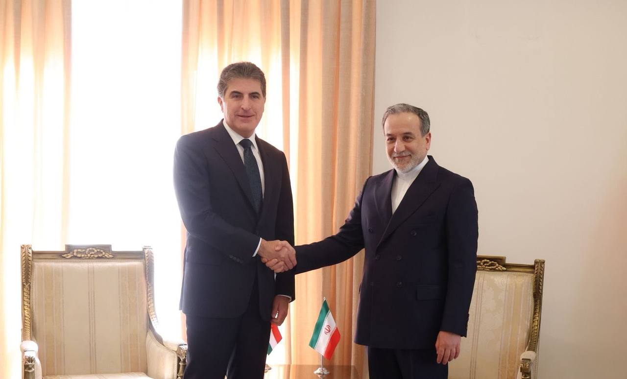 File photo from May 2025 shows Iran's Foreign Minister Abbas Araghchi (right) shaking hands with Kurdistan President Barzani.