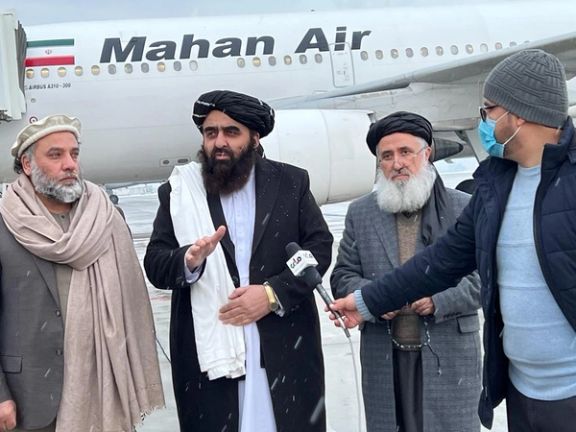 Taliban foreign minister Amir Khan Muttaqi at the airport before leaving for Tehran.