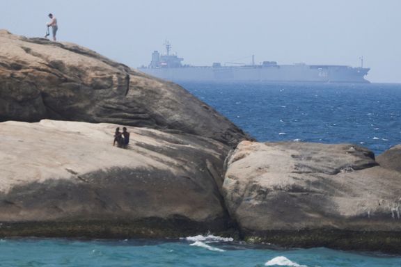 Iranian military ship Iris Makran navigates on the coast of Rio de Janeiro as beachgoers sunbathe on the stones of Arpoador Beach, Brazil, February 27, 2023.