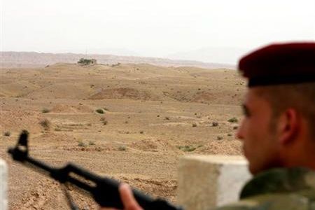 An Iraqi soldier keeps guard near the Iraq-Iran border