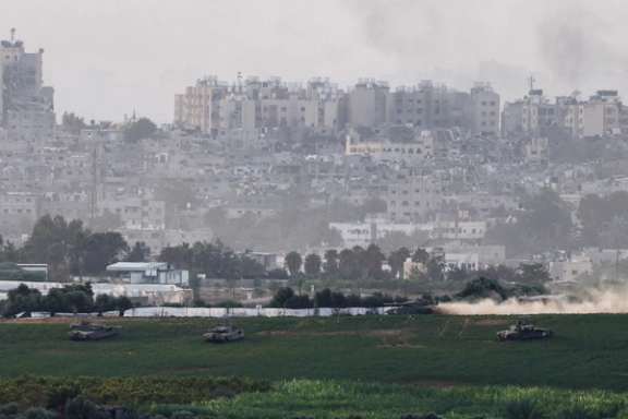 Israeli tanks manoeuvre inside the Gaza Strip, as seen from Israel, October 29, 2023.