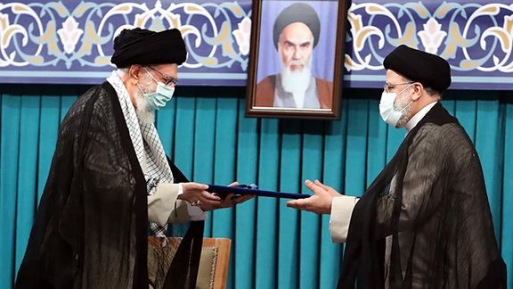 Khamenei handing his decree to President Raisi empowering him to take office. August 3, 2021