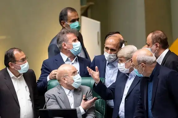 Lawmakers arguing with Speaker Ghalibaf in Iran's parliament in October 2021.
