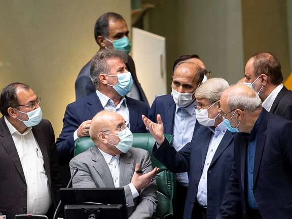 Iranian lawmakers arguing with Speaker Ghalibaf in a session in October 2021