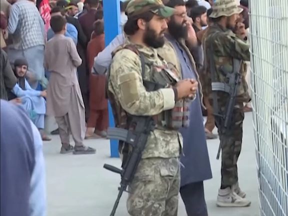 Holding the first cricket match under the Taliban with two flags