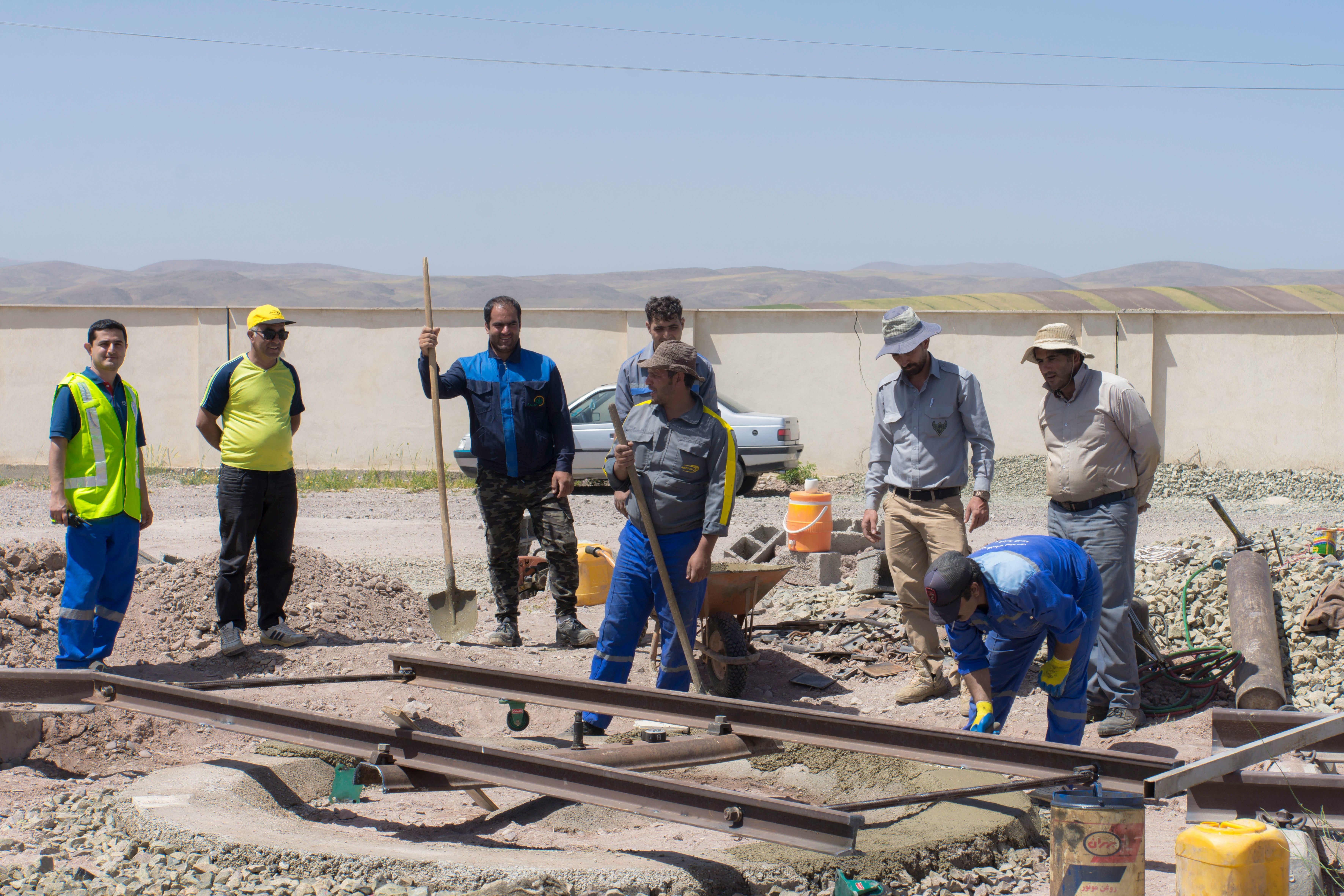 File photo of workers carrying out construction and maintenance work in Iran.
