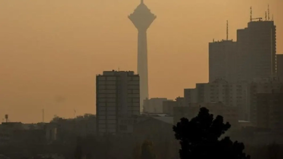 A view of Tehran shrouded in air pollution and experiencing blackouts
