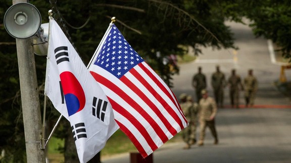 The South Korean and American flags fly next to each other at Yongin, South Korea, August 23, 2016.