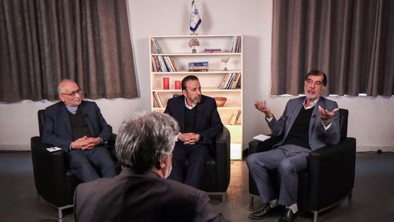 Three prominent politicians discussing Iran's political and economic impasse.