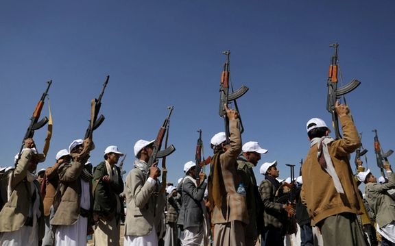 Armed Houthi followers hold up rifles as they take part in a parade to decry the US-led strikes on Houthi targets amid the ongoing conflict between Israel and the Palestinian Islamist group Hamas, near Sanaa, Yemen January 25, 2024.