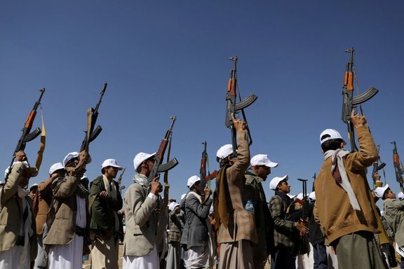 Armed Houthi followers hold up rifles as they take part in a parade to decry the US-led strikes on Houthi targets amid the ongoing conflict between Israel and the Palestinian Islamist group Hamas, near Sana'a, Yemen January 25, 2024.