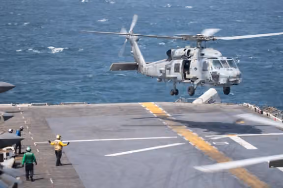 A US Navy MH-60R Sea Hawk helicopter prepares to land aboard the USS Boxer in an image posted by US Central Command on X on September 11, 2026.