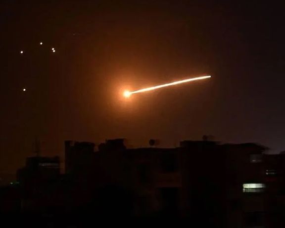 Missiles streak through the sky in an earlier Israeli attack on Iranian targets in Syria.