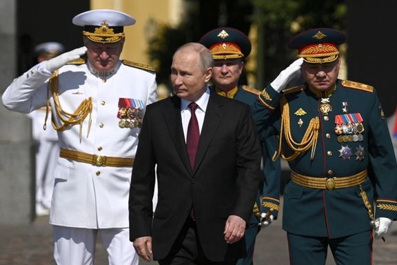 Russian President Vladimir Putin, Defence Minister Sergei Shoigu and Admiral Nikolai Yevmenov attend an annual Navy Day parade in Saint Petersburg, July 30, 2023.