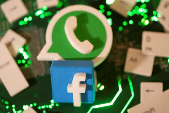 3D printed Facebook and WhatsApp logos and keyboard buttons are placed on a computer motherboard in this illustration taken January 21, 2021.