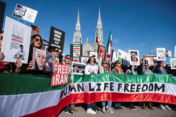 Protestors in support of women in Iran hold a banner reading 'Women Life Freedom' during a protest following the death of Mahsa Amini, in Ottawa, Ontario, Canada, October 29, 2022.