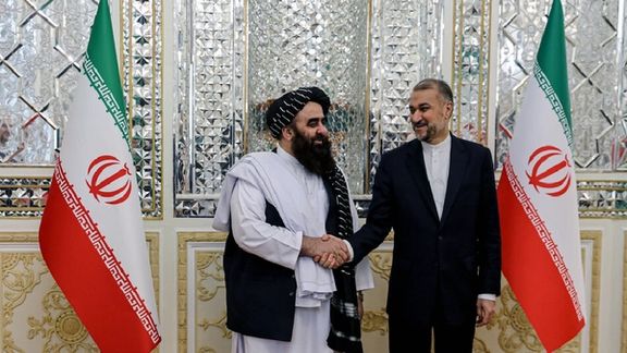 Taliban's Foreign Minister Amir Khan Muttaqi (left) and his Iranian counterpart Hossein Amir-Abdollahian in Tehran (December 2023)