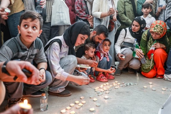 People lighting candles in memory of civilians who lost their lives in Israeli strikes, Tehran, Iran, June 25, 2025