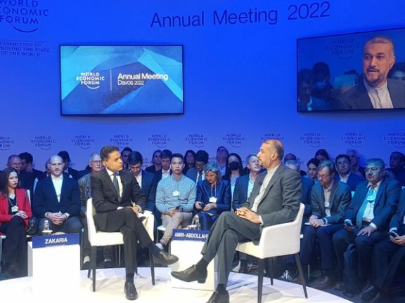 Iran’s Foreign Minister Hossein Amir-Abdollahian (right) speaks at the World Economic Forum in Davos, Switzerland, on May 26, 2022.