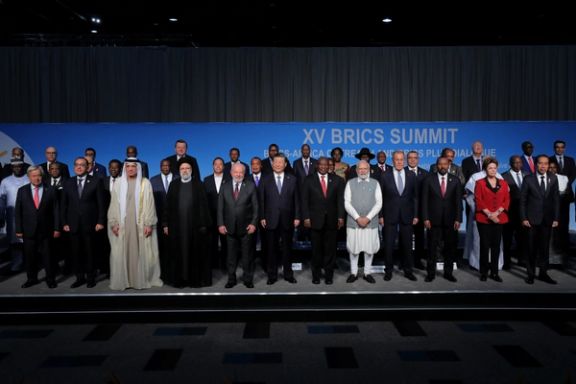 Participants of the BRICS summit pose for a group photo at the Sandton Convention Centre in Johannesburg on August 24, 2023