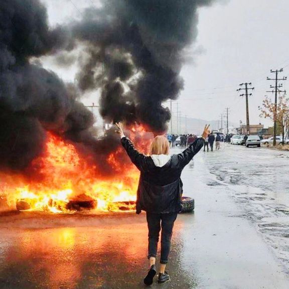 An Iranian girl unveiling in protest