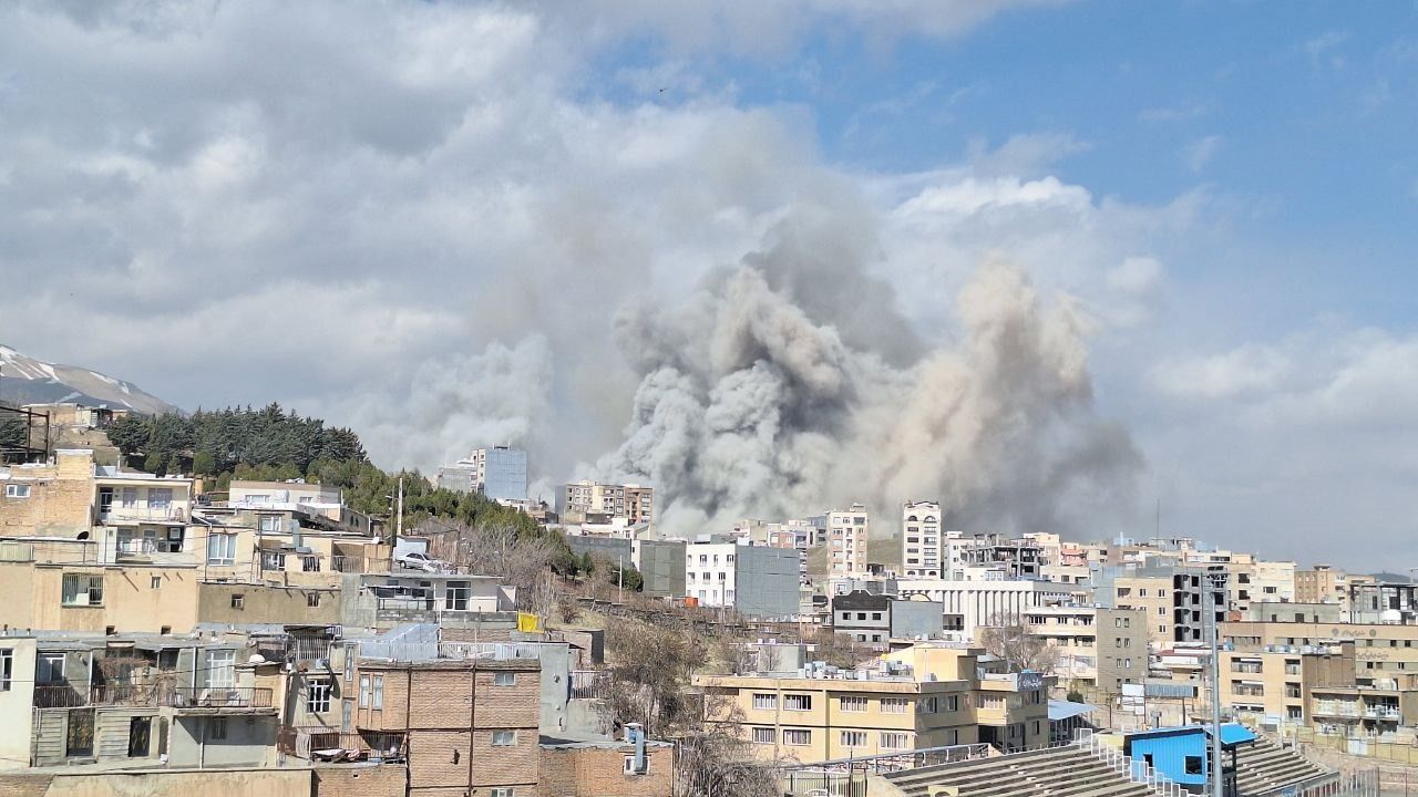 Smoke rises over a district of Tehran following Israeli-US airstrikes