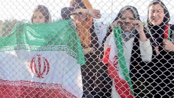 Women held behind the fences, not allowed to enter the stadium to watch a match. March 29, 2022