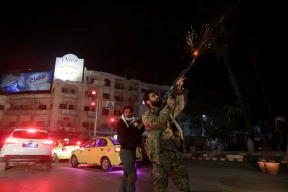 Syrian rebel forces celebrate after taking the city of Hama. December 5, 2024