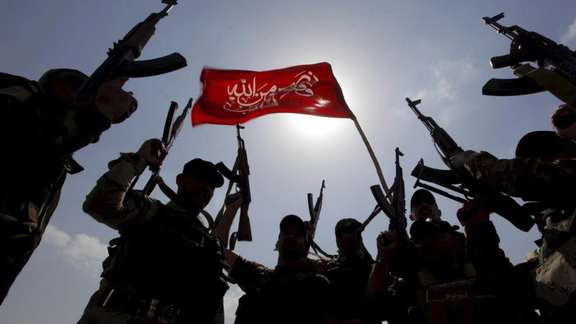Hashid Shaabi (Popular Mobilisation) forces allied with Iraqi forces chant slogans against the Islamic State in Tikrit, File Photo.