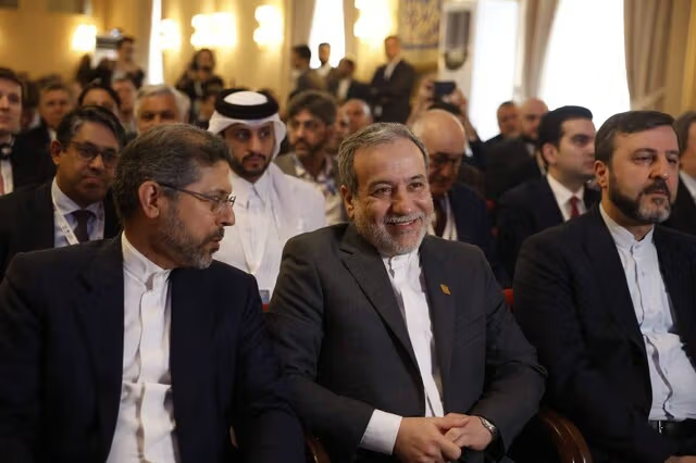 Iran's FM Abbas Araghchi (center), accompanied by his deputies Saeed Khatibzadeh (left) and Kazem Gharibabadi (right), attends an event in Tehran (Undated)