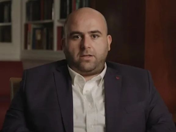 Mohammad Mosaed, exiled Iranian journalist delivering a taped message on November 18, 2021