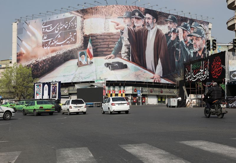 Iran’s top negotiator declares victory in war as army chief offers bounty for US troops