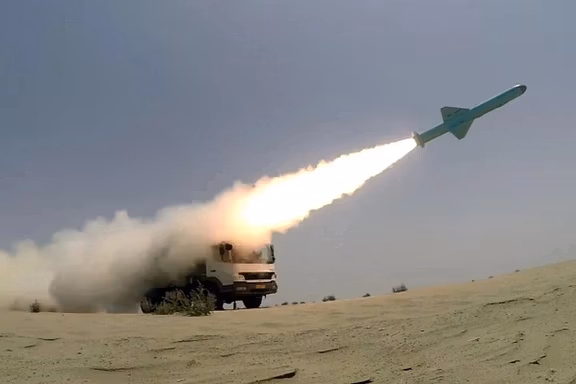 A missile is launched from a mobile launcher in an Iranian military drill
