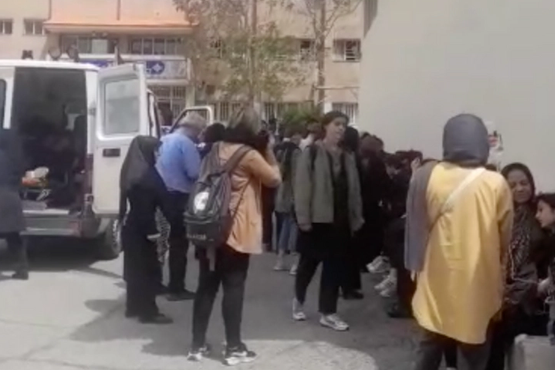 Parents gather at one of the schools targeted by poisonous gas attack on April 10, 2023.